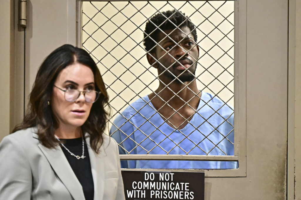 Lil Nas X, whose legal name is Montero Lamar Hill, is arraigned in court, next to his attorney Christy O'Connor, on four felony counts, including three counts of battery with injury on a police officer, Monday, Aug. 25, 2025, in Los Angeles. (Frederic J Brown/Pool Photo via AP)
