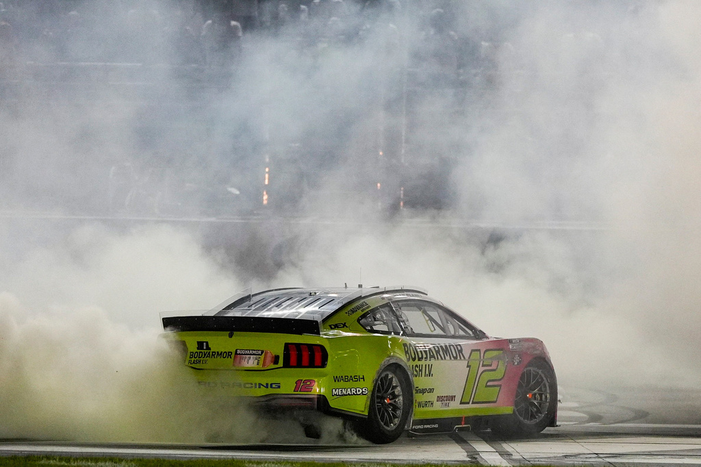 Ryan Blaney celebrates after winning a NASCAR Cup Series auto race, Sunday, July 12, 2026, in Hampton, Ga. (AP Photo/Mike Stewart)