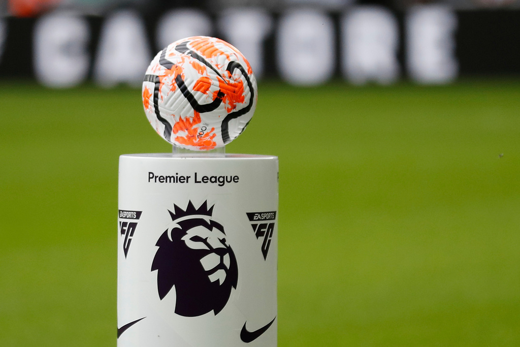 FILE - The match ball is set on a pedestal with the logo of the English Premier League before the soccer match between Newcastle and Aston Villa, in Newcastle, England, on Aug. 12, 2023. (AP Photo/Steve Luciano, File)