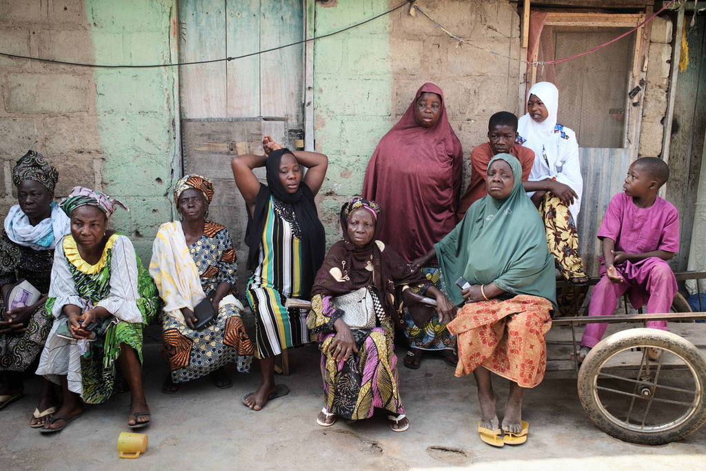 Survivors gather on the third day of Islamic prayers for one of the victims of an extremist attack, in Kaiama, Nigeria, Friday, Feb. 6, 2026. (AP Photo/Pelumi Salako)