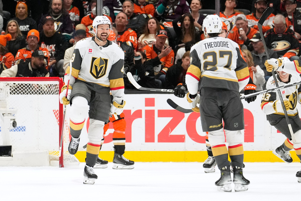 Vegas Golden Knights defenseman Shea Theodore, right, celebrates his goal with center Tomas Hertl, left, during the first period in Game 6 of a second-round NHL hockey Stanley Cup playoff series against the Anaheim Ducks, Thursday, May 14, 2026, in Anaheim, Calif. (AP Photo/Mark J. Terrill)