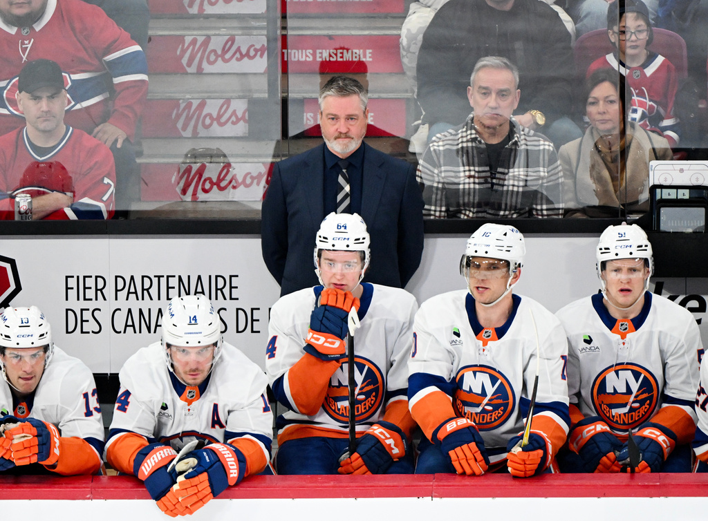 New York Islanders head coach Patrick Roy looks on from the bench during the first period of an NHL hockey game against the Montreal Canadiens in Montreal, Saturday, March 21, 2026. (Graham Hughes/The Canadian Press via AP)