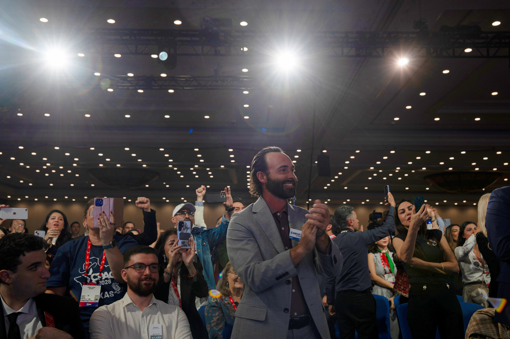 The crowd at the Conservative Political Action Conference (CPAC) gives exiled Iranian Crown Prince Reza Pahlavi a standing ovation in Dallas, Saturday, March 28, 2026. (AP Photo/Gabriela Passos)