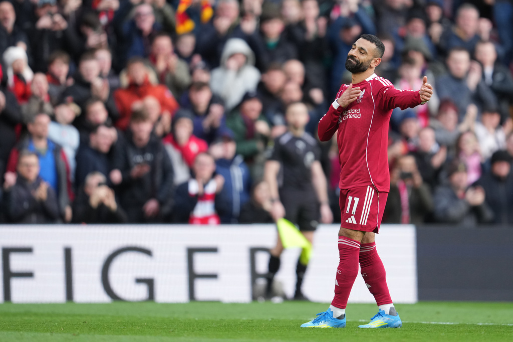 Liverpool's Mohamed Salah celebrates after scoring his side's second goal during the English Premier League soccer match between Liverpool and Fulham in Liverpool, England, Saturday, April 11, 2026. (AP Photo/Jon Super)