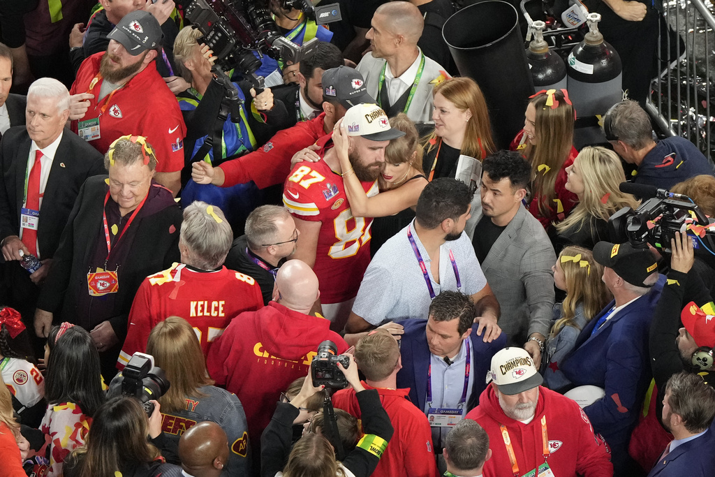 FILE - Kansas City Chiefs tight end Travis Kelce (87) hugs his girlfriend Taylor Swift after the team's victory over the San Francisco 49ers during the NFL Super Bowl 58 football game, Feb. 11, 2024, in Las Vegas. (AP Photo/David J. Phillip, File)