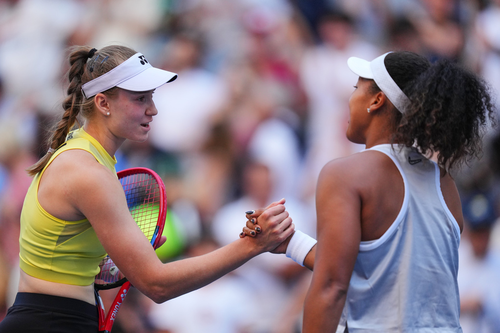 Elena Rybakina, of Kazakhstan, left, greets Naomi Osaka, of Japan, after winning a match during the fourth round of the U.S. Open tennis championships, Monday, Sept. 7, 2026, in New York. (AP Photo/Kirsty Wigglesworth)