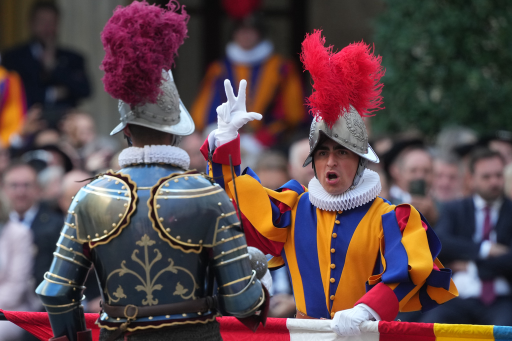 One of 27 cadets of the Pontifical Swiss Guard pronounces the swearing-in oath in the St. Damasus Courtyard at the Vatican, Saturday, Oct. 4, 2025. (AP Photo/Andrew Medichini)