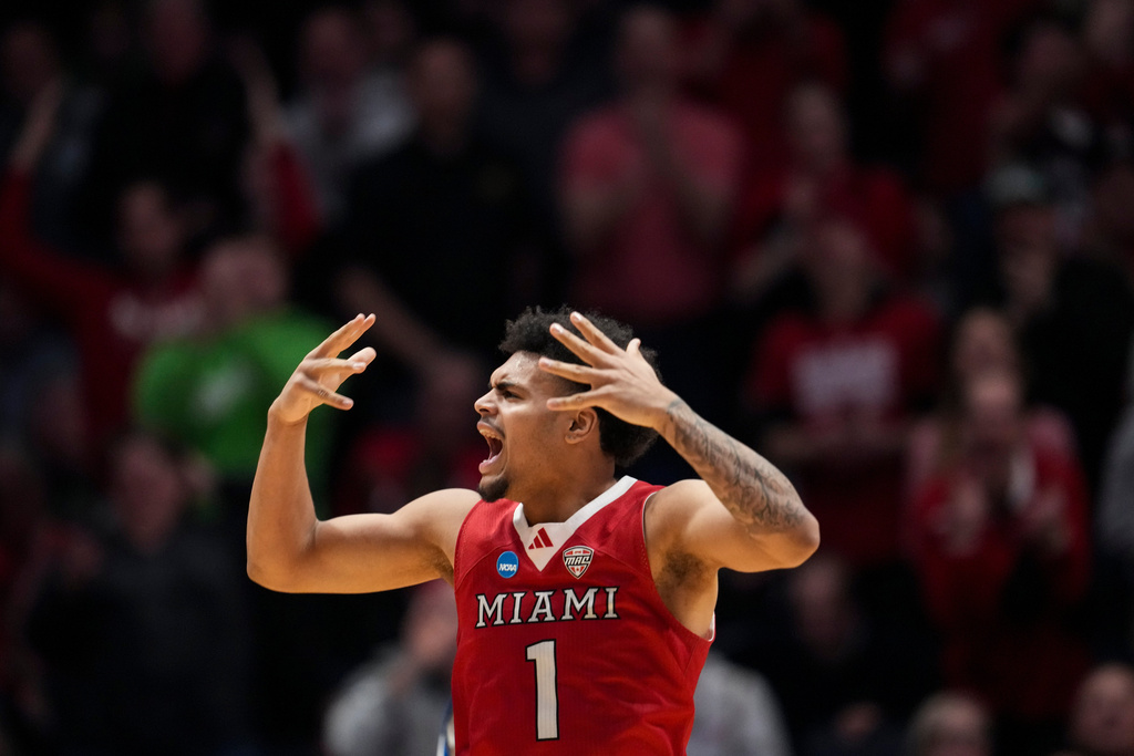 Miami (Ohio) guard Trey Perry reacts during the second half of a First Four college basketball game against SMU in the NCAA Tournament in Dayton, Ohio, Wednesday, March 18, 2026. (AP Photo/Jeff Dean)
