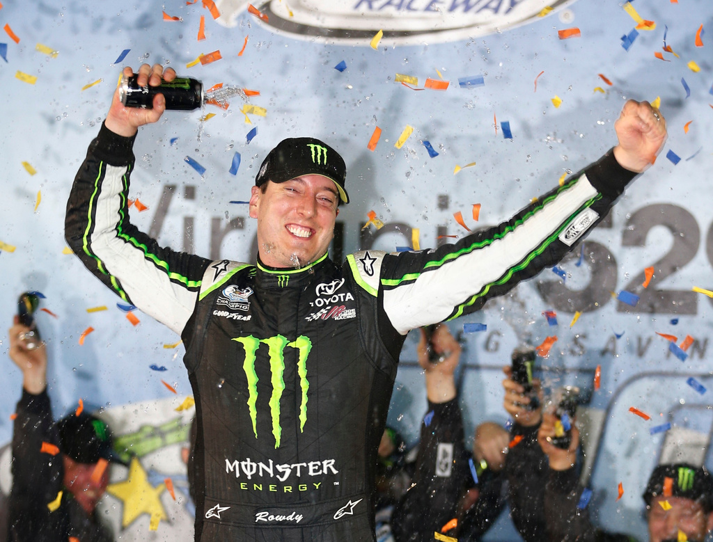 FILE - Kyle Busch celebrates his win in the NASCAR Nationwide series auto race, in Victory Lane at Richmond International Raceway in Richmond, Va., Friday, Sept. 5, 2014. (AP Photo/Steve Helber, File)