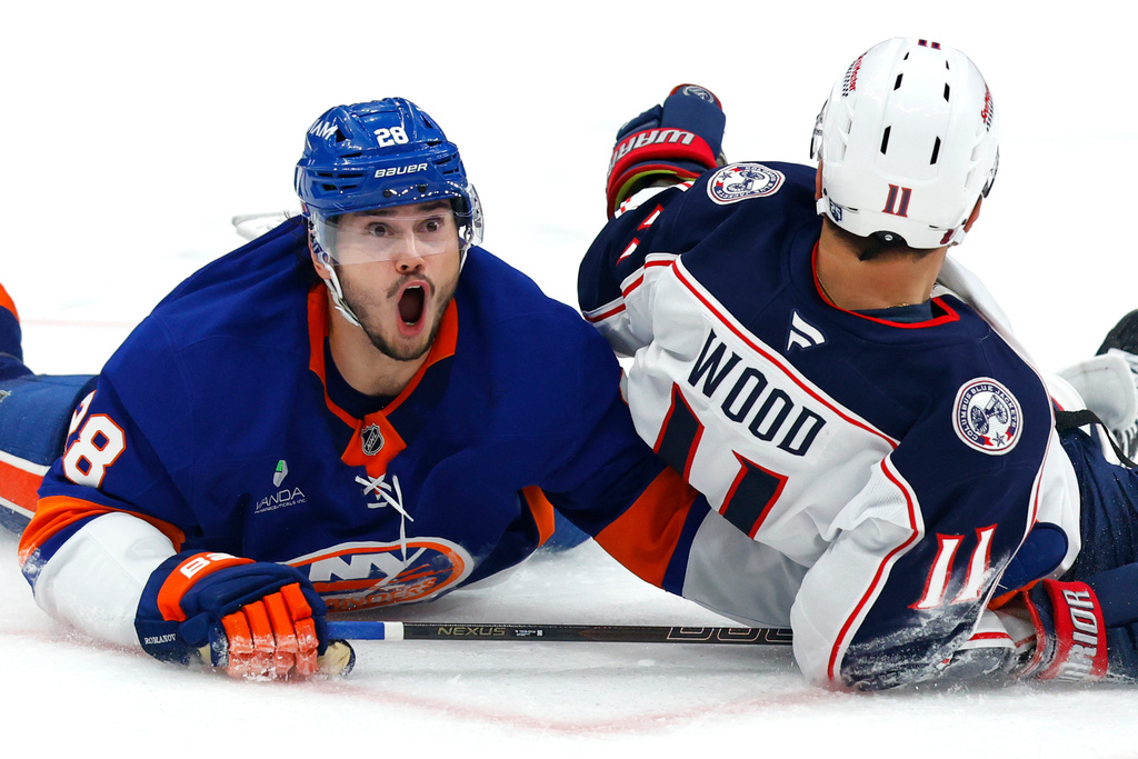 New York Islanders defenseman Alexander Romanov (28) reacts after being called for a hooking penalty against Columbus Blue Jackets left wing Miles Wood (11) during the third period of an NHL hockey game Sunday, Nov. 2, 2025, in New York. (AP Photo/Noah K. Murray)