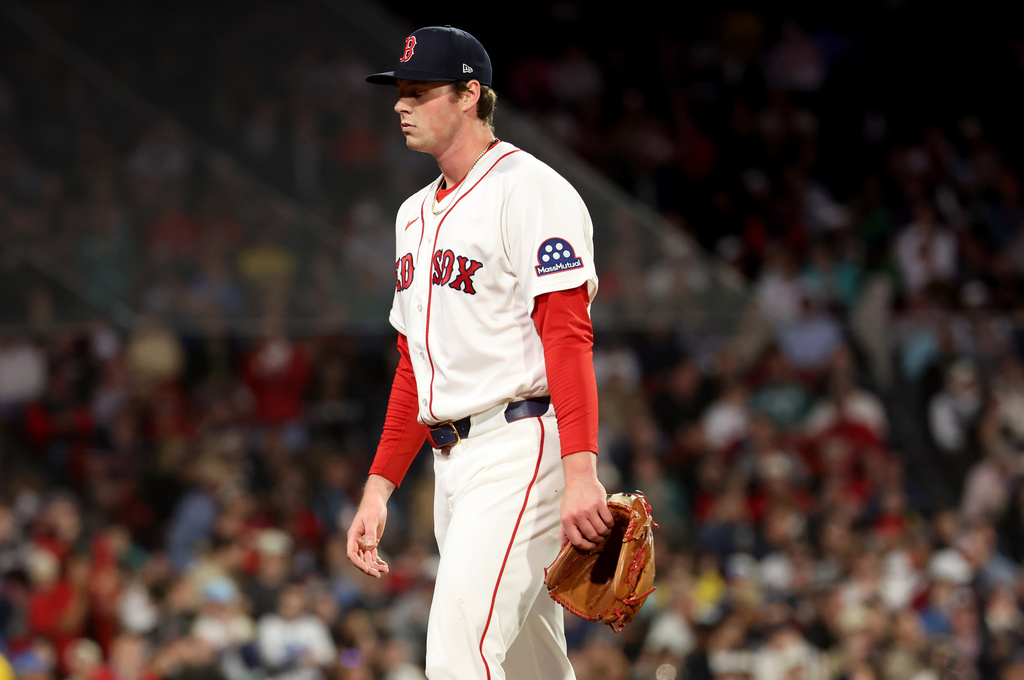 Boston Red Sox pitcher Jake Bennett walks off the field after being pulled out of the game during the sixth inning of a baseball game against the Tampa Bay Rays, Thursday, May 7, 2026, in Boston. (AP Photo/Mark Stockwell)