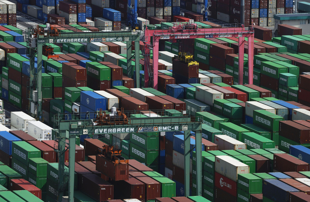 Containers are stacked at a port in Tokyo Tuesday, May 19, 2026. (Michi Ono/Kyodo News via AP)