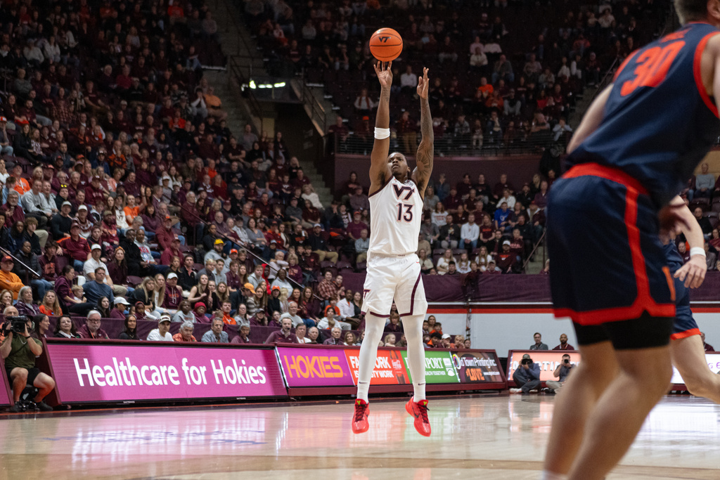 Virginia Tech guard Ben Hammond (3) shoots a three during the first half of an NCAA college football game, Wednesday, Dec. 31, 2025, in Blacksburg, Va. (AP Photo/Robert Simmons)