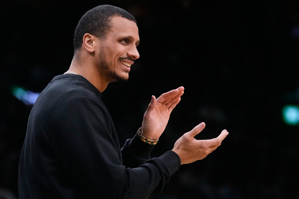 Boston Celtics head coach Joe Mazzulla applauds towards his players during the first half of an NBA basketball game against the Chicago Bulls, Monday, Jan. 5, 2026, in Boston. (AP Photo/Charles Krupa)