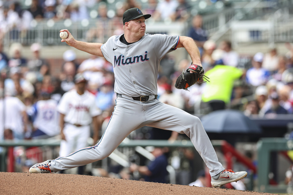 Miami Marlins pitcher Ryan Gusto delivers in the third inning of a baseball game against the Atlanta Braves, Saturday, Aug. 9, 2025, in Atlanta. (AP Photo/Colin Hubbard)