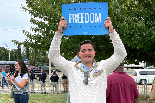 Petros Krommidas holds up a sign during an anti-Trump rally at Nassau Coliseum, Wednesday, Sept. 18, 2024, in Uniondale, N.Y. (Mark DeFrancesco via AP) Petros Krommidas holds up a sign during an anti-Trump rally at Nassau Coliseum, Wednesday, Sept. 18, 2024, in Uniondale, N.Y. (Mark DeFrancesco via AP)