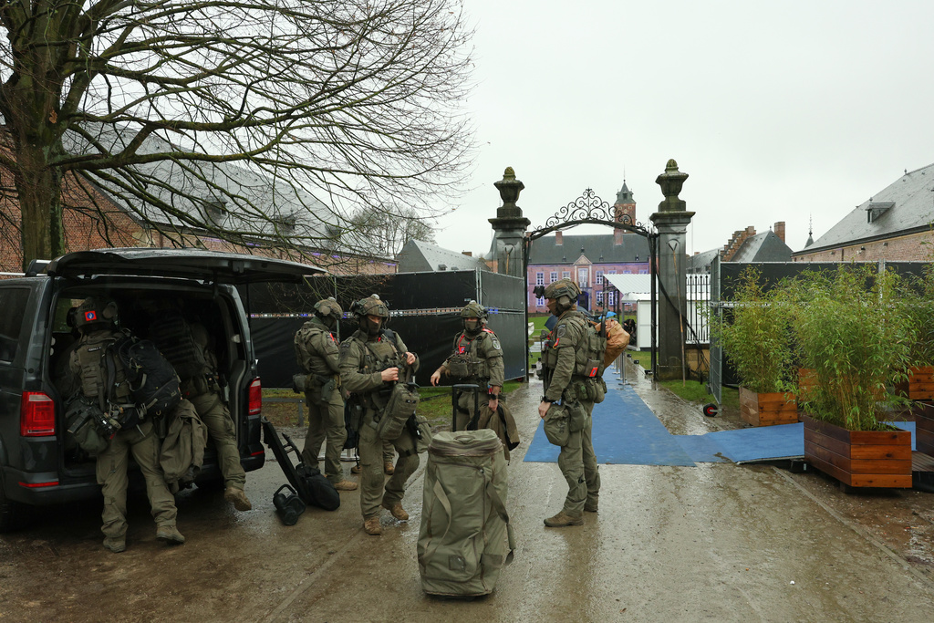 Belgian soldiers gather their gear outside the EU summit venue at the Alden Biesen Castle domain in Bilzen-Hoeselt, Belgium, Thursday, Feb. 12, 2026. (AP Photo/Omar Havana)