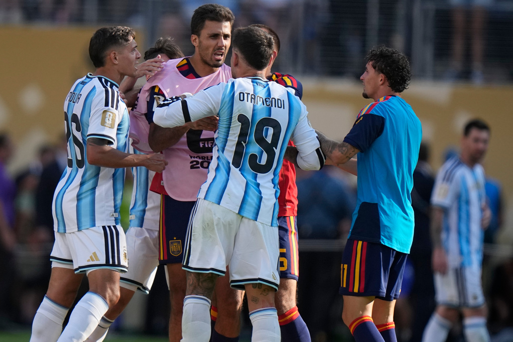 Argentina's Nicolas Otamendi (19) and Nahuel Molina (26) scuffle with Spain’s Rodri (16) after the World Cup final soccer match between Spain and Argentina in East Rutherford, N.J., near New York, Sunday, July 19, 2026. (AP Photo/Frank Franklin II)