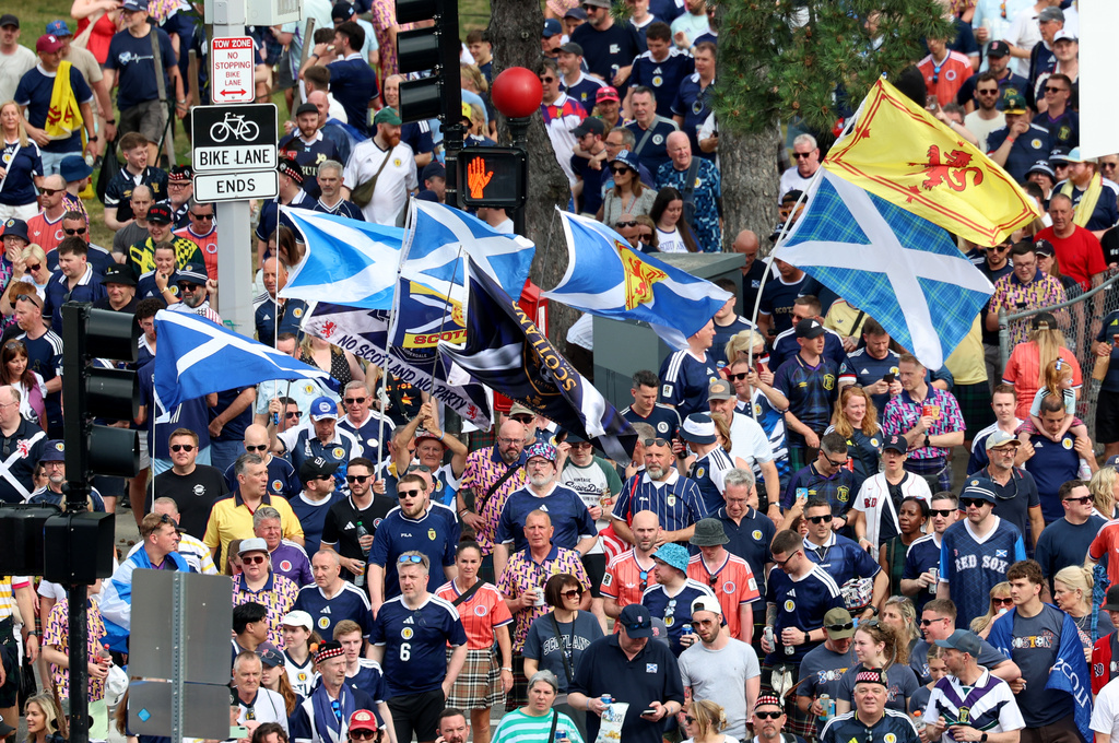 Scotland soccer fans take part in the Tartan Army March, making their way to Fenway Park ahead of a baseball game between the Boston Red Sox and the Texas Rangers, Sunday, June 14, 2026, in Boston. (AP Photo/Mark Stockwell)