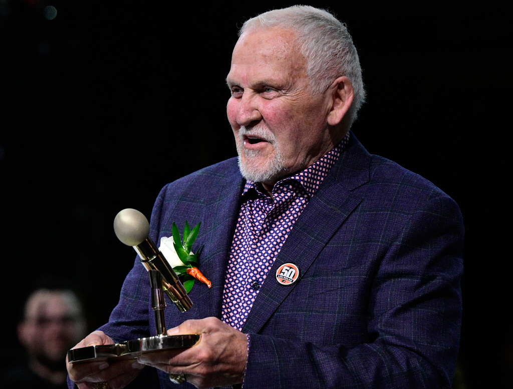 FILE - Former Philadelphia Flyers goalie Bernie Parent during a ceremony for public address announcer Lou Nolan prior to an NHL hockey game against the Anaheim Ducks, Saturday, April 9, 2022, in Philadelphia. (AP Photo/Derik Hamilton, File)