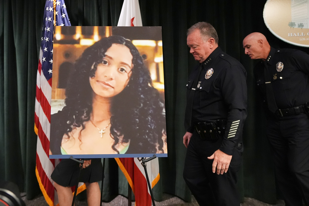 LAPD Chief Jim McDonnell walks past an image of Celeste Rivas Hernandez Monday, April 20, 2026, in Los Angeles after a press conference regarding the case of singer D4vd, who was charged on suspicion of killing the 14-year-old girl whose dismembered body was found in his car. (AP Photo/Damian Dovarganes)