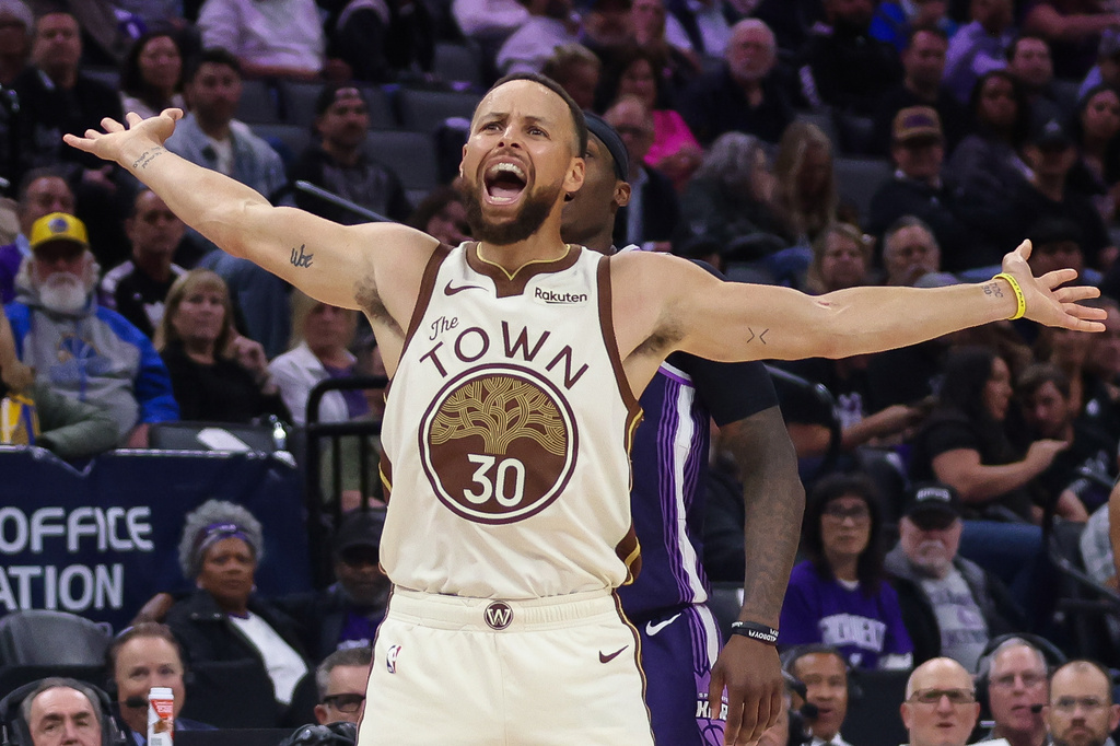 Golden State Warriors guard Stephen Curry (30) reacts after being fouled but the basket didn't count during the second half of an NBA basketball game against the Sacramento Kings, Friday, April 10, 2026, in Sacramento, Calif. (AP Photo/Scott Marshall)