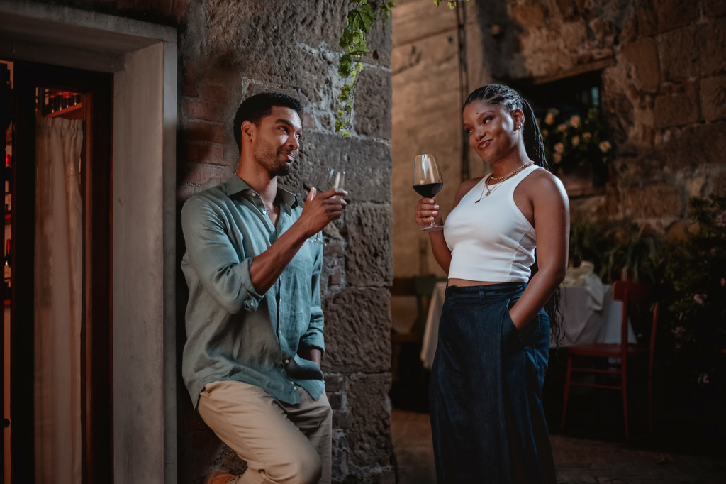 This image released by Universal Pictures shows Halle Bailey, right, and Regé-Jean Page in a scene from "You, Me & Tuscany." (Giulia Parmigiani/Universal Pictures via AP)