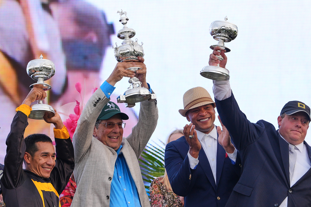 From left, jockey Paco Lopez, owner Al Gold, Maryland Gov. Wes Moore, and trainer Chad Summers celebrate after Napoleon Solo won the 151st running of the Preakness Stakes horse race, Saturday, May 16, 2026, at Laurel Park in Laurel, Md. (AP Photo/Julia Demaree Nikhinson)