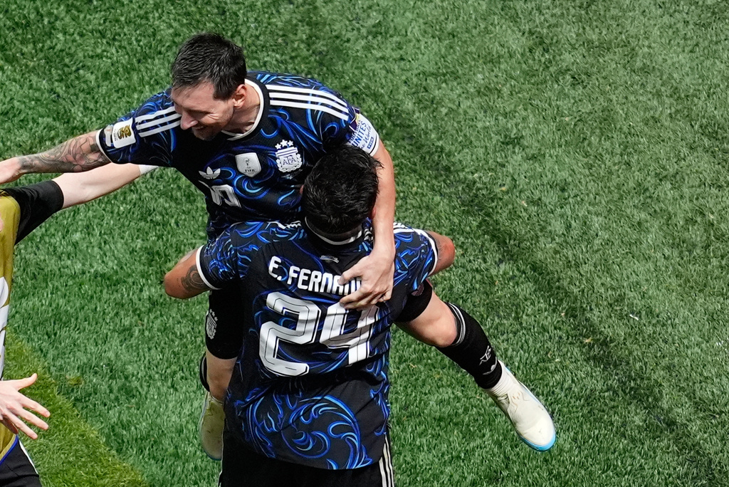 Argentina's Enzo Fernandez (24) celebrates with Lionel Messi (10) after Lautaro Martinez scored the team's second goal during the World Cup semifinal soccer match between England and Argentina in Atlanta, Wednesday, July 15, 2026. (AP Photo/Mike Stewart)