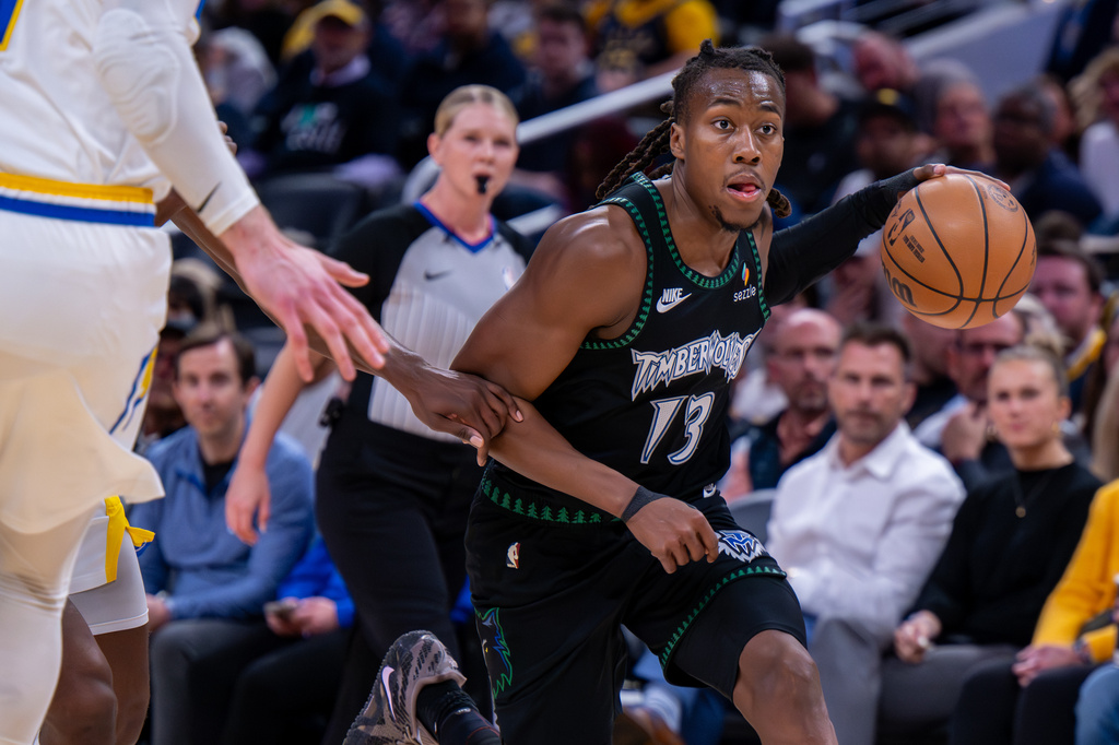 Minnesota Timberwolves guard Ayo Dosunmu (13) drives toward the basket during the first half of an NBA basketball game against the Indiana Pacers in Indianapolis, Tuesday, April 7, 2026. (AP Photo/Doug McSchooler)