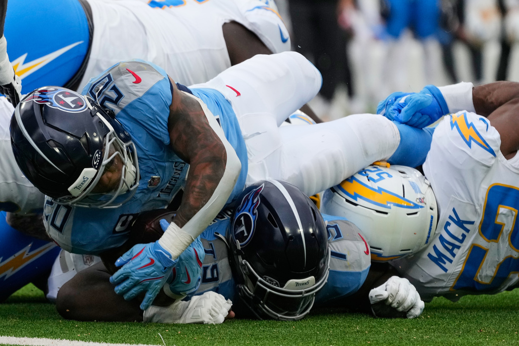 Tennessee Titans running back Tony Pollard (20) is stopped short of the goal line during the second half of an NFL football game against the Los Angeles Chargers, Sunday, Nov. 2, 2025, in Nashville, Tenn. (AP Photo/George Walker IV)