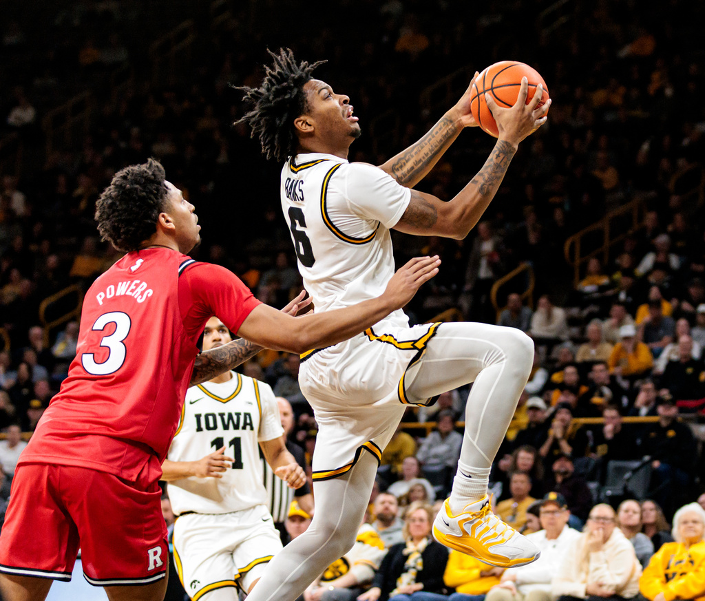 Iowa guard Tavion Banks (6) drives to the basket during an NCAA basketball game between Iowa and Rutgers at Carver-Hawkeye Arena in Iowa City, Iowa on Tuesday, Jan. 20, 2026. (Nick Rohlman/The Gazette via AP)