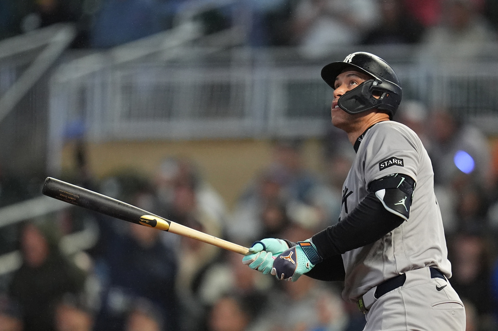 New York Yankees' Aaron Judge watches his three-run home run during the eighth inning of a baseball game against the Minnesota Twins, Monday, Sept. 14, 2026, in Minneapolis. (AP Photo/Abbie Parr)