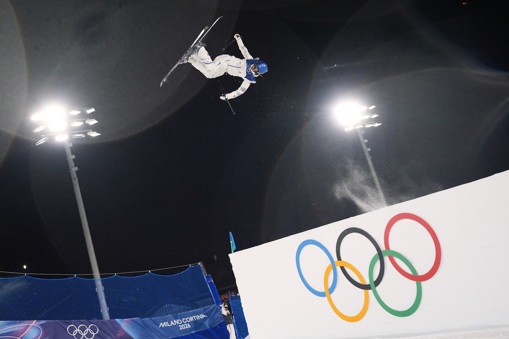 China's Eileen Gu warms up before the women's freestyle skiing big air qualifications at the 2026 Winter Olympics, in Livigno, Italy, Saturday, Feb. 14, 2026. (AP Photo/Lindsey Wasson)