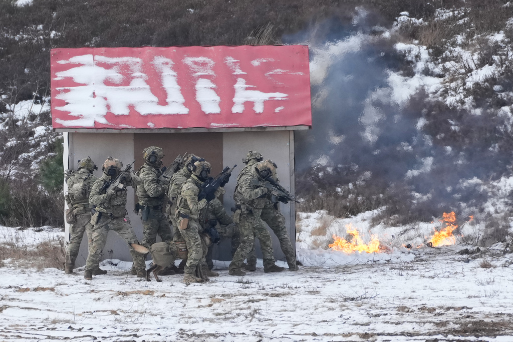 Soldiers attend NATO led military exercises at a military base near Bergen, Germany, Thursday, Feb. 19, 2026. (AP Photo/Virginia Mayo)