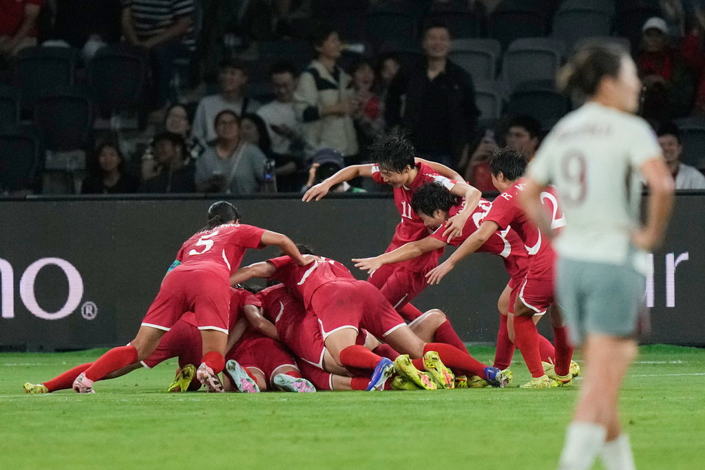 North Korean players celebrate after their first goal during the Women's Asian Cup soccer match between China and North Korea in Sydney, Monday, March 9, 2026. (AP Photo/Rick Rycroft)
