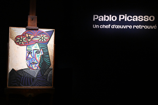 The rediscovered Picasso painting "Bust of a Woman in a Flowery Hat" is presented Wednesday, Oct. 22, 2025 in Paris. The portrait painted in 1943 will be sold at auction Friday in Paris, was bought in 1944 and shows his partner Dora Maar. (AP Photo/Emma Da Silva) The rediscovered Picasso painting "Bust of a Woman in a Flowery Hat" is presented Wednesday, Oct. 22, 2025 in Paris. The portrait painted in 1943 will be sold at auction Friday in Paris, was bought in 1944 and shows his partner Dora Maar. (AP Photo/Emma Da Silva)