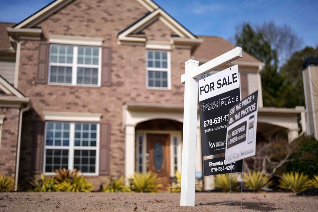FILE - A "For Sale" sign is displayed outside a home, Feb. 1, 2024, in Aceworth, Ga. (AP Photo/Mike Stewart, File)