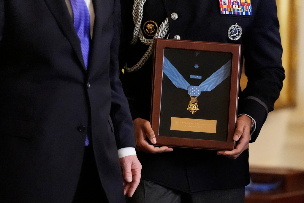 Military aide holds the Medal of Honor for Master Sergeant Roderick Edmonds, to be presented posthumous to his son Chris Edmonds, in a ceremony in the East Wing of the White House in Washington, Monday, March 2, 2026. (AP Photo/Mark Schiefelbein)