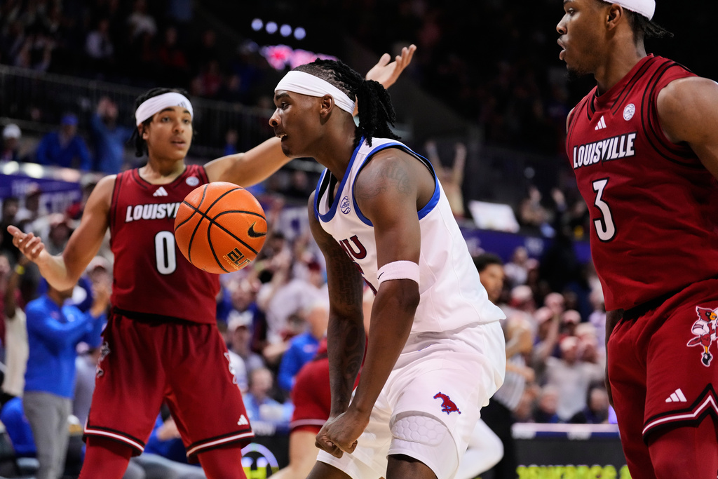 SMU guard Jaron Pierre Jr. (5) celebrates after dunking as Louisville's Mikel Brown Jr. (0) and Ryan Conwell (3) look on in the second half of an NCAA college basketball game in Dallas, Tuesday, Feb. 17, 2026. (AP Photo/Tony Gutierrez)