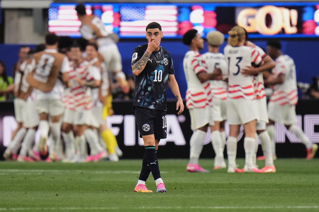 Paraguay's Miguel Almiron reacts after the United States scored a third goal during the World Cup Group D soccer match in Inglewood, Calif., near Los Angeles, Friday, June 12, 2026. (AP Photo/Jae C. Hong)