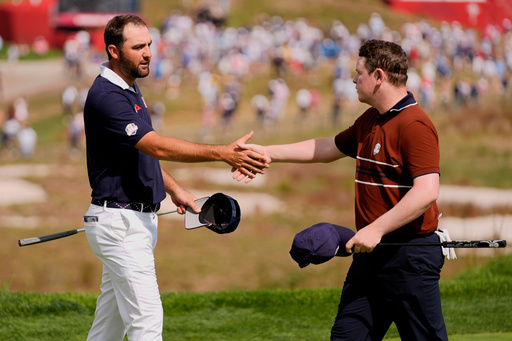 United States' Scottie Scheffler shakes hand with Europe's Robert MacIntyre on the 18th hole at Bethpage Black golf course during the Ryder Cup golf tournament, Saturday, Sept. 27, 2025, in Farmingdale, N.Y. (AP Photo/Robert Bukaty) United States' Scottie Scheffler shakes hand with Europe's Robert MacIntyre on the 18th hole at Bethpage Black golf course during the Ryder Cup golf tournament, Saturday, Sept. 27, 2025, in Farmingdale, N.Y. (AP Photo/Robert Bukaty)
