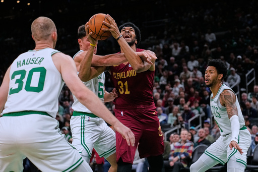 Cleveland Cavaliers center Jarrett Allen, center, tries to drive to the basket against the Boston Celtics during the first half of an NBA basketball game, Wednesday, Oct. 29, 2025, in Boston. (AP Photo/Charles Krupa) Cleveland Cavaliers center Jarrett Allen, center, tries to drive to the basket against the Boston Celtics during the first half of an NBA basketball game, Wednesday, Oct. 29, 2025, in Boston. (AP Photo/Charles Krupa)