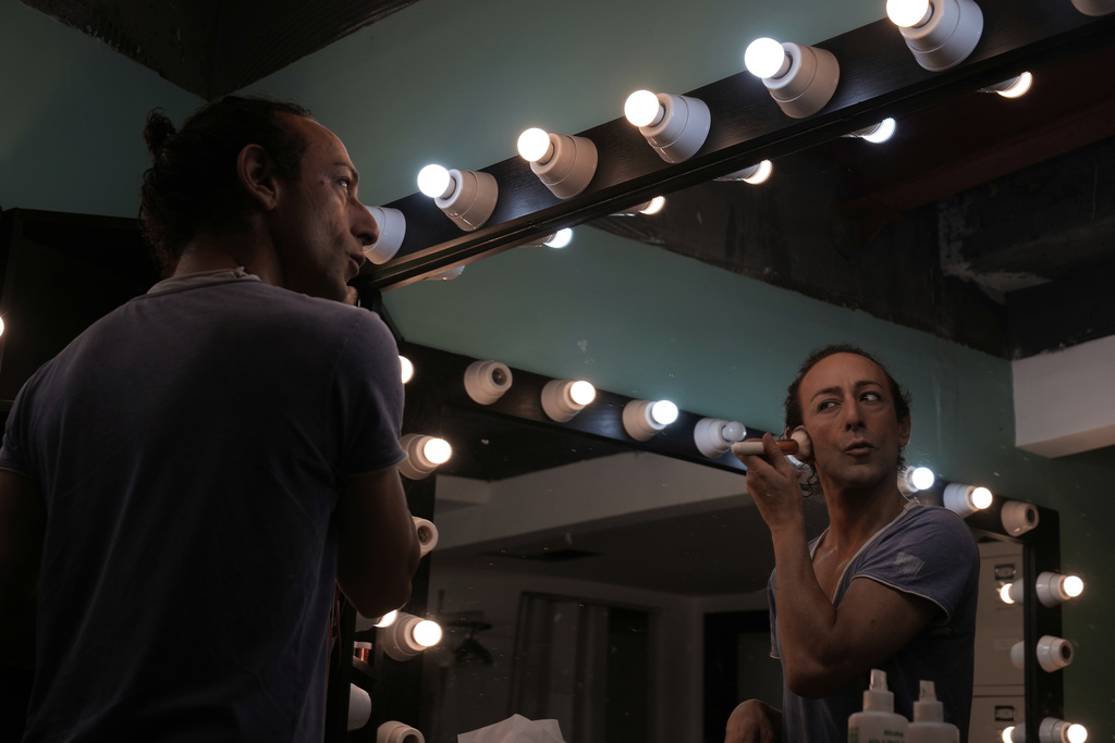 Alexandre Paulikevitch applies makeup backstage before performing at a theatre in Beirut, Lebanon, Thursday, Sept. 11, 2025. (AP Photo/Hussein Malla)