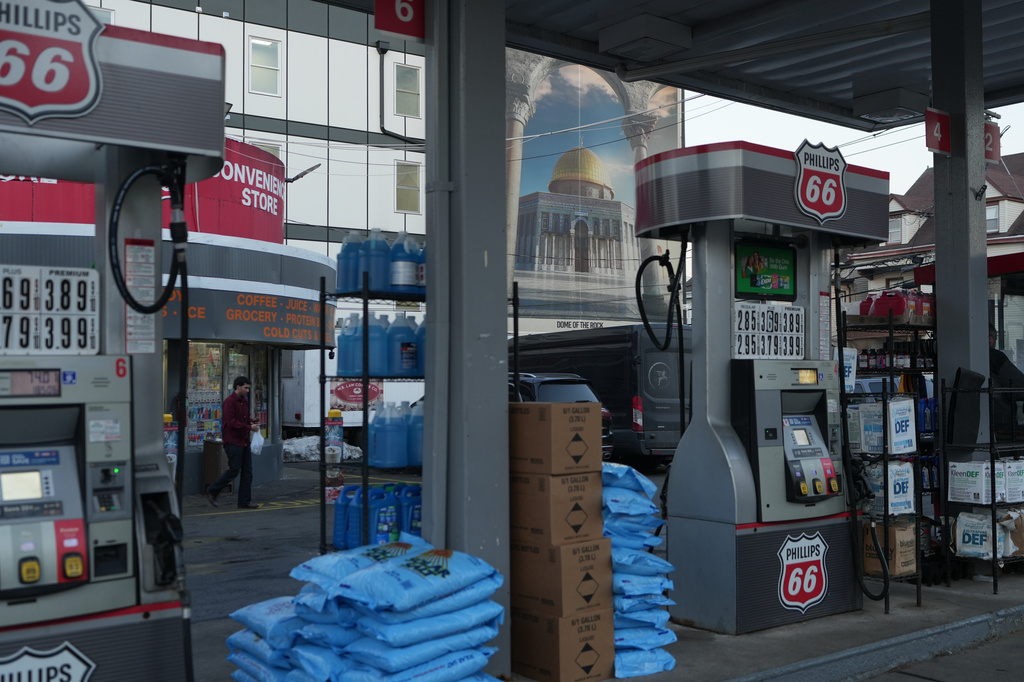 A gas station in Paterson, N.J., is seen near a mural-sized image of the Dome of the Rock shrine at the Al-Aqsa Mosque compound in Jerusalem's Old City during Ramadan on Friday, Feb. 27, 2026. (AP Photo/Luis Andres Henao)
