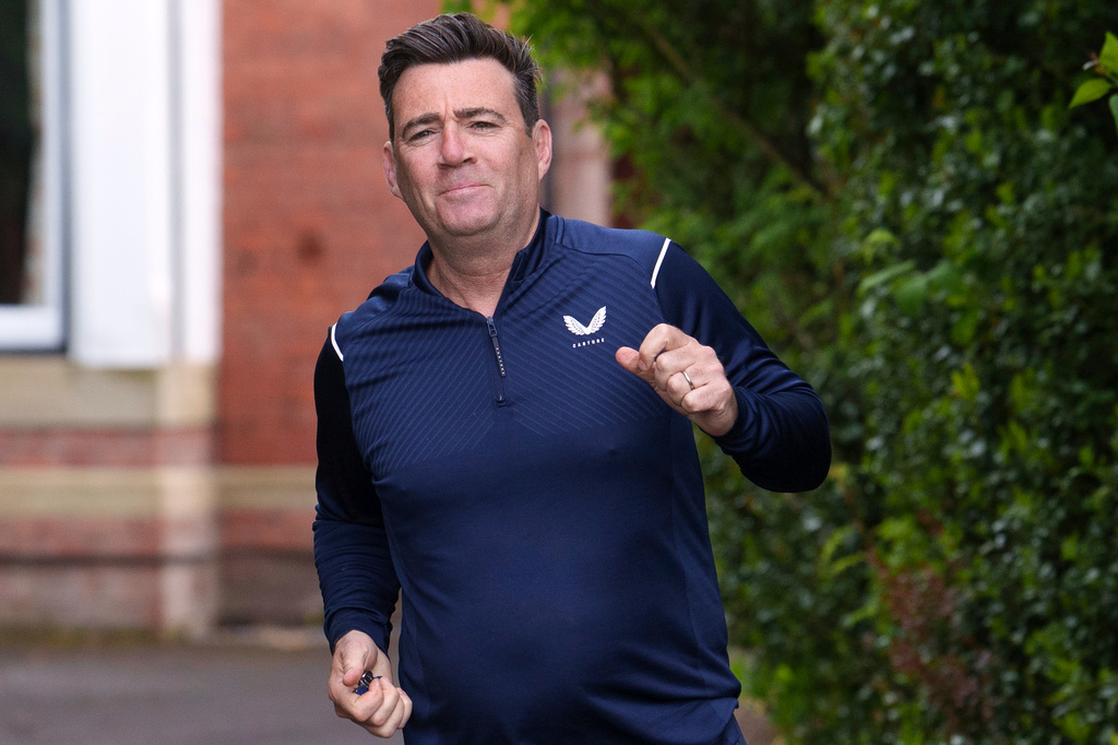 The Mayor of Greater Manchester, Andy Burnham, starts a morning run in Manchester, England, Monday, May 18, 2026 whilst Britain's government is in turmoil, and some see Andy Burnham as the one to save it. (AP Photo/Jon Super)