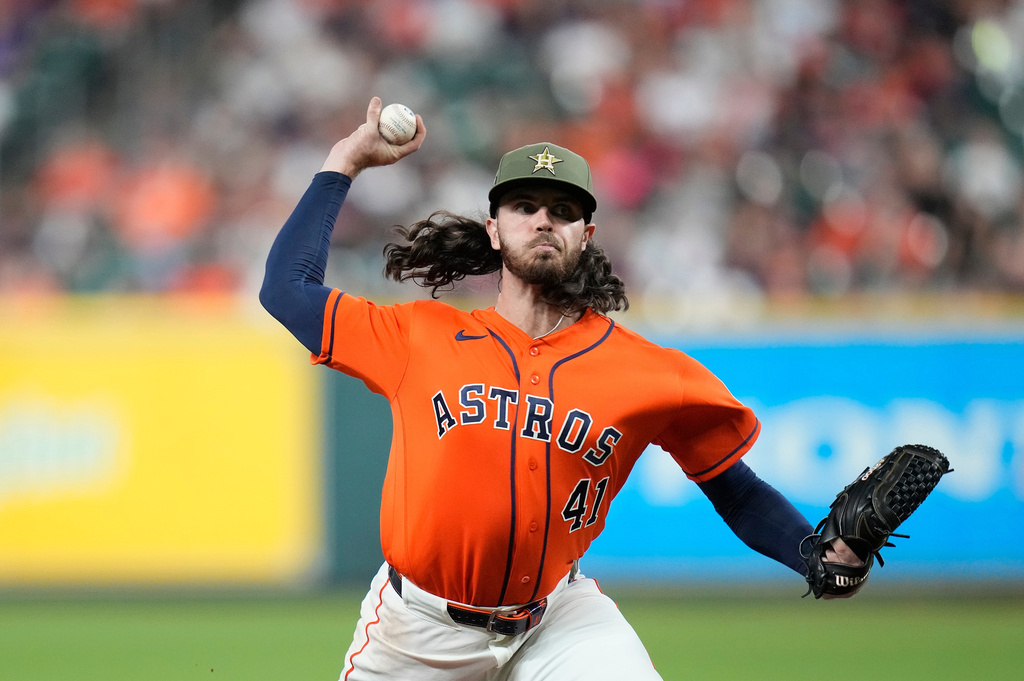 Houston Astros starting pitcher Spencer Arrighetti delivers to Texas Rangers' Jake Burger during the seventh inning of a baseball game, Friday, May 15, 2026, in Houston. (AP Photo/Karen Warren)