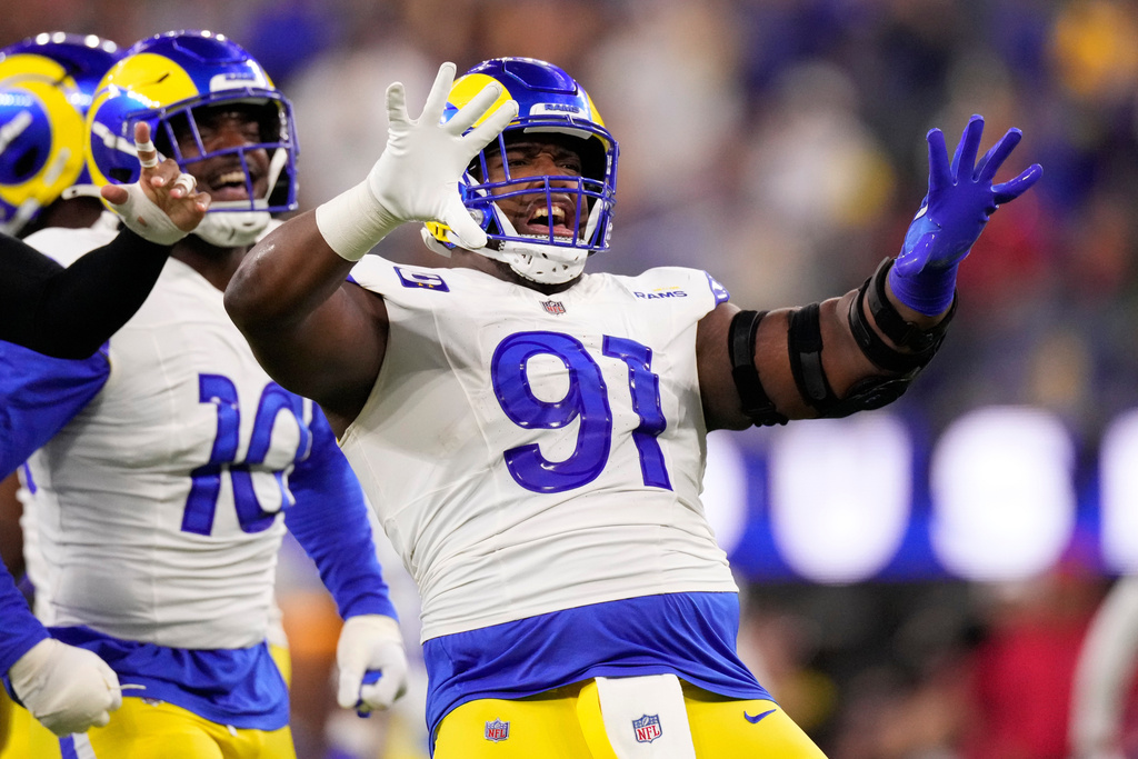 Los Angeles Rams defensive end Kobie Turner (91) reacts during the first half against the Tampa Bay Buccaneers in an NFL football game, Sunday, Nov. 23, 2025, in Inglewood, Calif. (AP Photo/Mark J. Terrill)