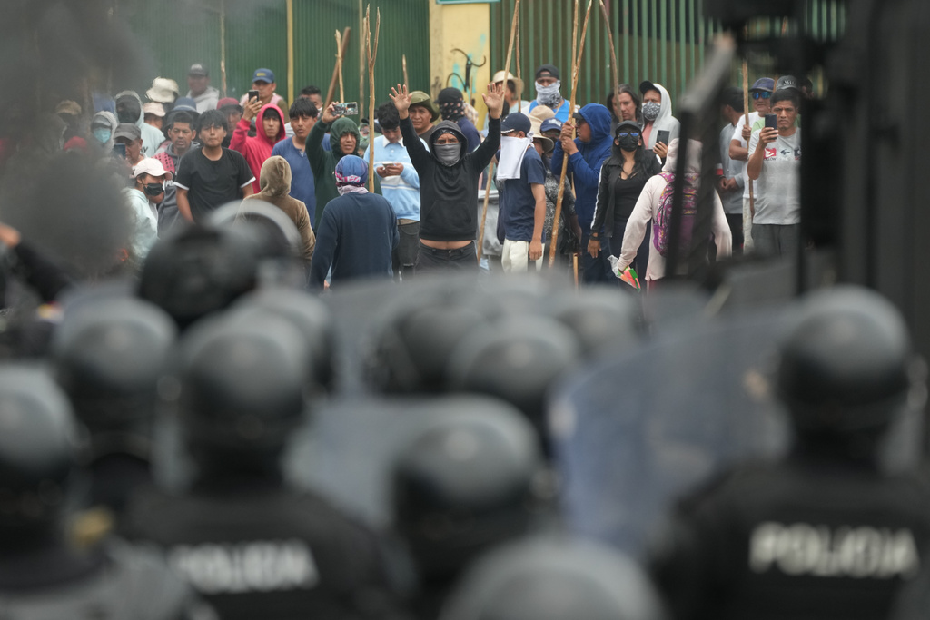 Soldiers face off with demonstrators during protests over the elimination of the diesel subsidy by President Daniel Noboa's government, in Calderon, Ecuador, Thursday, Oct. 9, 2025. (AP Photo/Dolores Ochoa)