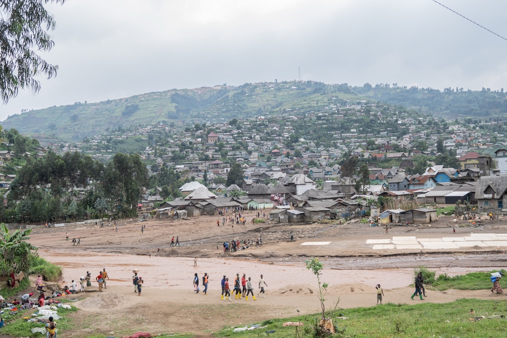 People walk in the mining town of Rubaya, eastern Democratic Republic of Congo, Monday, Dec. 1, 2025, as a measles vaccination campaign gets underway. (AP Photo/Moses Sawasawa)